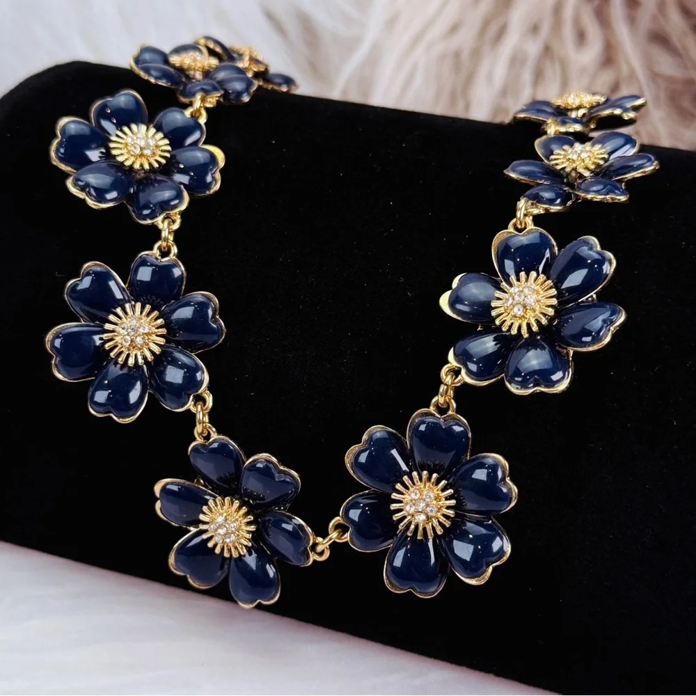 Beautiful, vintage goldtone, blue enamel, clear, bling weighted necklace